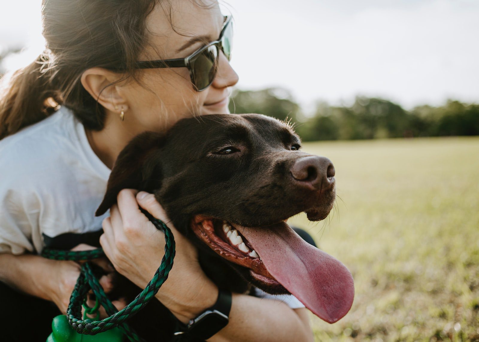 woman hugging a dog